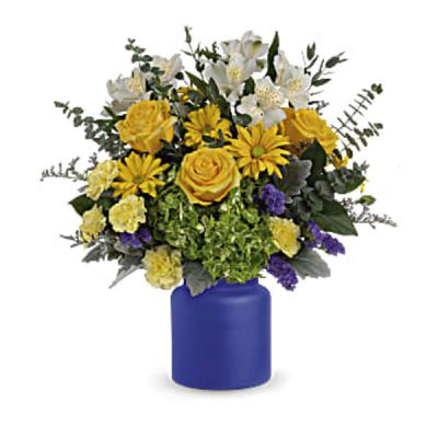 Capture the magic of a sunrise at sea with this radiant white and yellow bouquet, arranged in a frosted glass vase the color of the deep ocean.