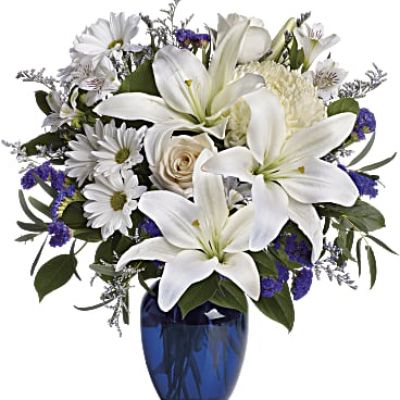 <div class="m-pdp-tabs-description">
<div id="mark-1" class="m-pdp-tabs-marketing-description">In this arrangement, the serenity of the color blue along with the purity of intention symbolized by white will express your feelings wonderfully.</div>
</div>
<p id="arrngDescp">Beautiful blooms such as blue hydrangea, crème roses, white lilies and alstroemeria along with yellow and white chrysanthemums, eucalyptus, limonium and more are beautifully arranged in a dazzling blue vase.</p>