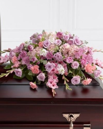 <p>The FTD® Immorata™ Casket Spray offers soft beauty and blushing comfort to honor the life of the deceased. Lavender roses, chrysanthemums and parrot tulips are elegantly arranged amongst pink carnations, gladiolus, stock, hydrangea and lush greens to create a presentation, intended to bedeck the top of the casket, that evokes sweet memories of your loved one for their final farewell service.</p>
