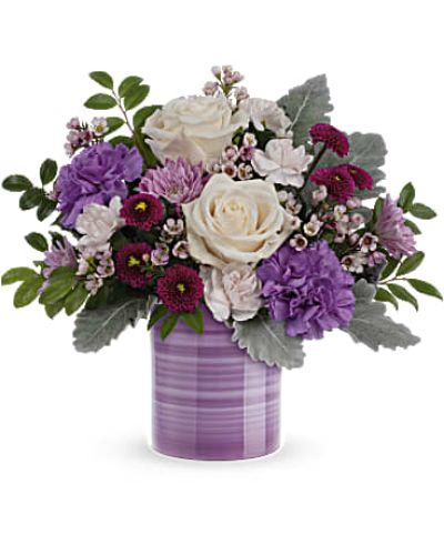 <div id="mark-3" class="m-pdp-tabs-marketing-description">
<div id="mark-3" class="m-pdp-tabs-marketing-description">Swirling with hand-painted bands of soft lavender, this sweet ceramic keepsake vase makes a marvelous Mother's Day gift filled with a bouquet of creamy roses and purple blooms.</div>
<p> </p>
<div id="desc-3">Crème roses, purple carnations, miniature light pink carnations, lavender cushion spray chrysanthemums, purple button spray chrysanthemums and pink waxflower are arranged with dusty miller and huckleberry.</div>
</div>