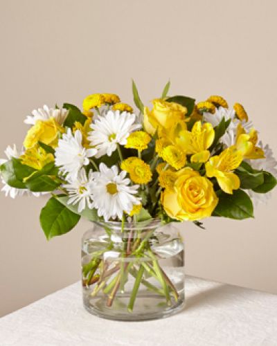 This sun-kissed assortment of white and yellow blooms brightens the room with radiance. Whether you want to boost someone&rsquo;s mood or send happiness, this bouquet is just the right pick.