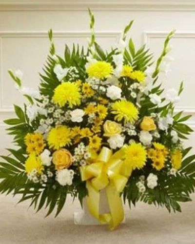 <p>When dealing with the loss of a family member, friend or colleague, finding the perfect expression of sympathy can be difficult. Featuring a tasteful gathering of fresh yellow roses, cremones, white gladiolas, carnations, monte casino and more, our heartfelt floor basket arrangement will help you convey all the comfort and support that's in your heart. Appropriate for family, friends or business associates to send directly to the funeral home.</p>