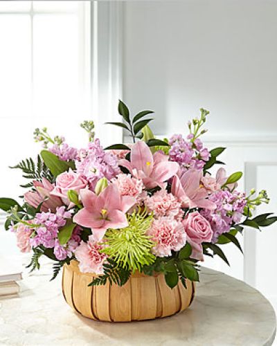 Let them know how much you care with a gorgeous bouquet that features carnations, stock, roses, lilies and Fuji mums. Each bloom is a thoughtful reminder of your support and love, while sitting in a beautifully crafted basket.