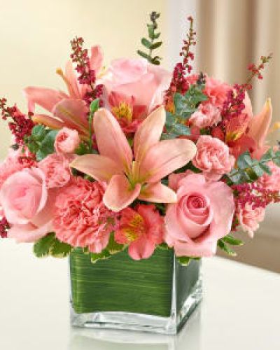 Let the vibrant beauty of our graceful all-pink bouquet convey your deepest love.
Help heal with this cube vase arrangement of pink roses, lilies, alstroemeria, carnations and heather.