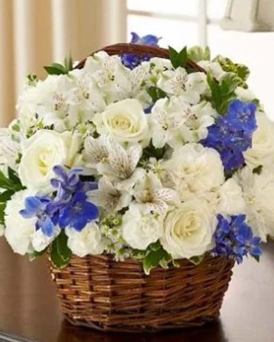 <p>Offer peace and comforting prayers during times of loss with this elegant blue and white basket arrangement. A graceful gathering of fresh roses, delphinium, alstroemeria, carnations, mini carnations and monte casino is accented with variegated pittosporum and myrtle. Appropriate to send to the home of friends and family members or to the memorial service.</p>