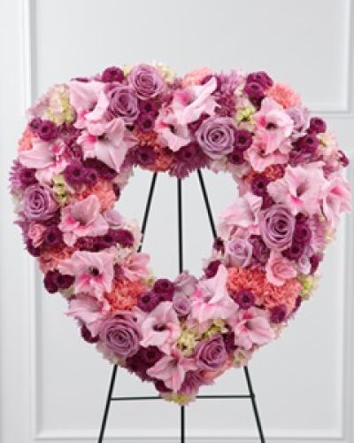 <p>The FTD® Eternal Rest™ Standing Heart bursts with love and sweet comfort to honor the deceased at their final farewell service. Lavender roses, pink carnations, purple button poms, lavender chrysanthemums, pink gladiolus and pink hydrangea are beautifully arranged in a the shape of a heart and displayed on a wire easel to create a stunning display of warm affection that will last in the hearts of friends and family for years to come.</p>