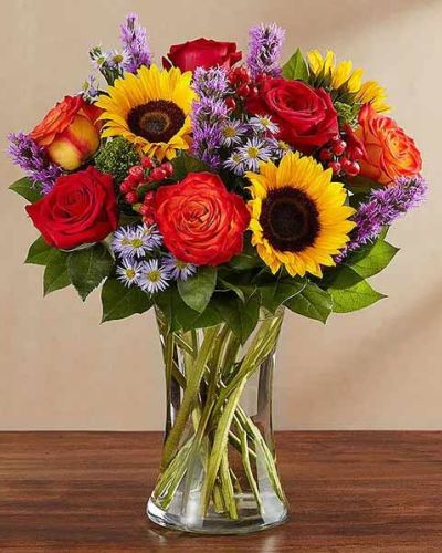 Bring the serene beauty of autumn to someone you care about with our country-inspired arrangement. Filled with a medley of fresh-picked blooms in brilliant colors, it&rsquo;s a gift that&rsquo;s sure to surprise & delight.
