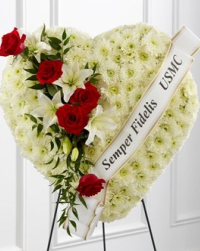 <p>Express your condolences with an arrangement that beautifully expresses comfort and honor within each bloom. Our Heartfelt Hero™ Standing Heart is made of a collection of cushion pompons, and accented with roses and lilies. To bring it all together, this breathtaking piece comes personalized with a printed ribbon.</p>