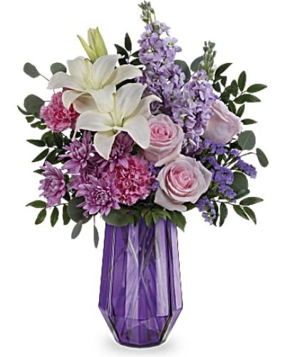 <div id="mark-3" class="m-pdp-tabs-marketing-description">
<div id="mark-3" class="m-pdp-tabs-marketing-description">Wish her a Mother's Day of wonder and whimsy with a breathtaking rose and lily bouquet in this stunning geometric glass vase.</div>
<p> </p>
<div id="desc-3">Light pink roses, white asiatic lilies, pink carnations, lavender stock and lavender cushion spray chrysanthemums are arranged with lavender sinuata statice, silver dollar eucalyptus and huckleberry.</div>
</div>