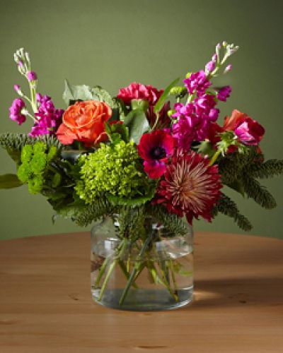 Our Bells & Whistles Bouquet is designed for the playful guest looking for a colorful twist on holiday classics. The electric pink anemone and green hydrangeas add a youthful pep to traditions and show there's more than one way to celebrate.