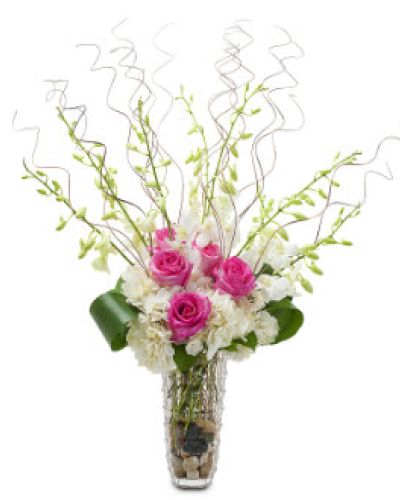 <p>Standout with Wisps of Wonder, a stunning display of hot pink roses, white hydrangea and orchids.</p>