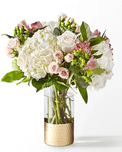 <p>Capturing the essence of a cool spring day, this delicate arrangement is the perfect statement of love, appreciation or admiration.</p>