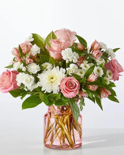 <p>Your recipient will be falling for these blushing alstroemeria and white mums, a beautiful way to share a Valentine wish, birthday delight, or gentle remembrance.</p>