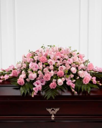 <p>Honor a loved one who was sweet, compassionate and charming with our Garden of Comfort™ Casket Spray. It is crafted with care and composed of a refined array of pink lilies, gladiolus, roses, carnations and accents of luscious greens. This arrangement is a touching tribute that beautifully expresses your love.</p>