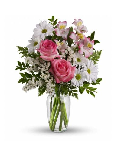 This lovely bouquet of pink roses, pink alstroemeria and white mums in a sparkling clear glass vase is an endearing way to Treat Your Sweet. It is an inspired choice for brightening a birthday, anniversary, special occasion or just because.