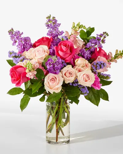 <p>These blooming pink roses, purple stock, and lavender carnations will have your recipient dancing with joy.</p>