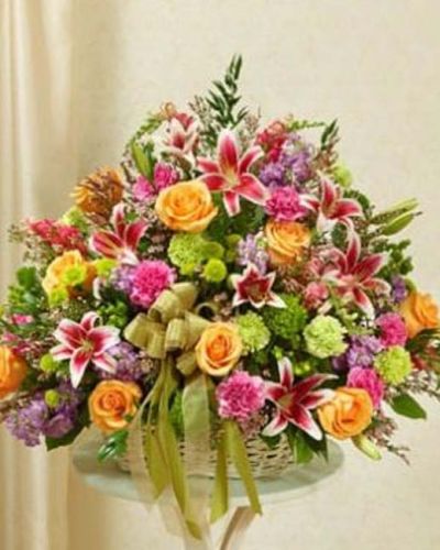 <p>Express your sympathy and compassion with this beautiful tribute arrangement of fresh pastel blooms. Designed by our skilled florists in an elegant handled willow basket, this arrangement features fresh pastel-toned roses, lilies, stock, snapdragons, carnations, poms, heather and more. Appropriate for friends, family and business associates to send either directly to the funeral home or to the family's home.</p>
