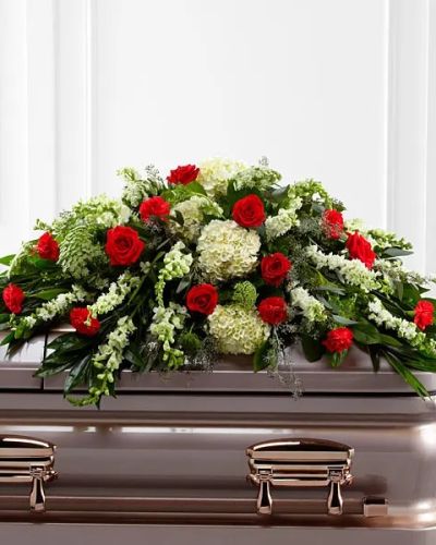 The FTD&reg; Sincerity&trade; Casket Spray is a wondrous presentation of fresh color and beauty. Rich red roses and carnations are eye-catching and elegant in an arrangement of white hydrangea, larkspur, snapdragons, Queen Anne's Lace and assorted lush greens to create a lovely display meant to bedeck the top of their casket, bringing comfort and peace to those grieving the loss of the departed.