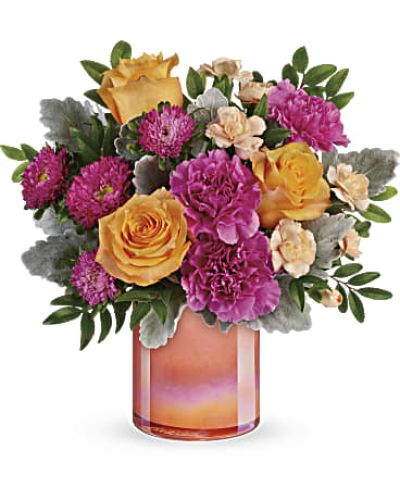 <div id="mark-3" class="m-pdp-tabs-marketing-description">
<div id="mark-3" class="m-pdp-tabs-marketing-description">
<div id="mark-3" class="m-pdp-tabs-marketing-description">Like a spectacular spring sunset, this radiant bouquet of oranges and pink blooms, presented in a peach glass vase with shimmering pearlized finish is sure to brighten anyone's day!</div>
This bouquet features peach roses, dark pink carnations, peach miniature carnations, hot pink matsumoto asters, dusty miller, and huckleberry.

</div>
</div>
