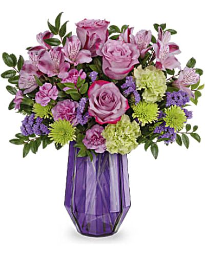 <div id="mark-3" class="m-pdp-tabs-marketing-description">
<div id="mark-3" class="m-pdp-tabs-marketing-description">
<div id="mark-3" class="m-pdp-tabs-marketing-description">Like a fine, faceted gemstone, Geometric Rose features a gorgeous glass vase that sparkles beneath a bouquet of lush lavender roses.</div>
<p>&nbsp;</p>
<div id="desc-3">Lavender roses, lavender alstroemeria, green carnations, miniature lavender carnations and green cushion spray chrysanthemums are arranged with purple sinuata statice and huckleberry.</div>
</div>
</div>