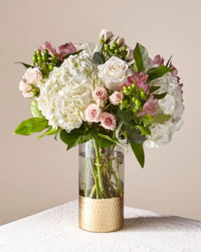 Give the gift of freshness with a vase full of Ros&eacute; All Day. This blush beauty brings elegant excitement to end tables and entryways alike with its selection of roses, hydrangea, spray roses, and more.