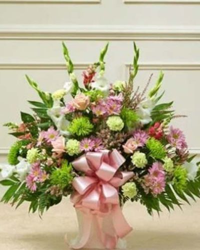 <p>When you're trying to find a way to express your deepest sympathy, this pastel floor basket helps you beautifully say what is in your heart. Our expert florists use only the freshest blooms - including pastel roses, gladiolas, snapdragons, mums, carnations, daisy poms, heather and more - to show your love and concern during a difficult time. Appropriate for family, friends or business associates to send directly to the funeral home.</p>