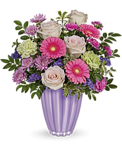 <div id="mark-3" class="m-pdp-tabs-marketing-description">Put a spring in their step with this playful bouquet of pink and purple blooms, presented to perfection in a pastel purple vase of European glass with radiant metallic finish.</div>
<p> </p>
<div id="desc-3">Blush roses, miniature pink gerberas, green carnations, miniature hot pink carnations and lavender cushion spray chrysanthemums are arranged with huckleberry and pitta negra. res</div>