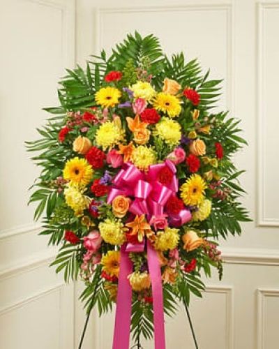 <p>Crafted from fresh and brightly colored blooms, our heartfelt standing spray is a beautiful symbol of your love and support. Gathered with roses, lilies, Gerbera daisies, mums, snapdragons, alstroemeria, carnations and more, it conveys your deepest sympathies and lets them know they are in your thoughts. An appropriate expression of your sympathy for family, friends and business associates to send directly to the funeral home.</p>